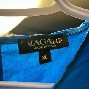 This beautiful blue dress was made in Italy.